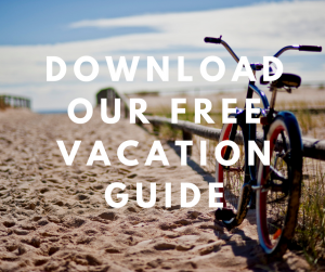 Bike on the sand with download our free vacation guide text