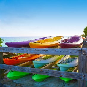 Santa Rosa Beach Kayak rentals stacked up overlooking the ocean and the beach