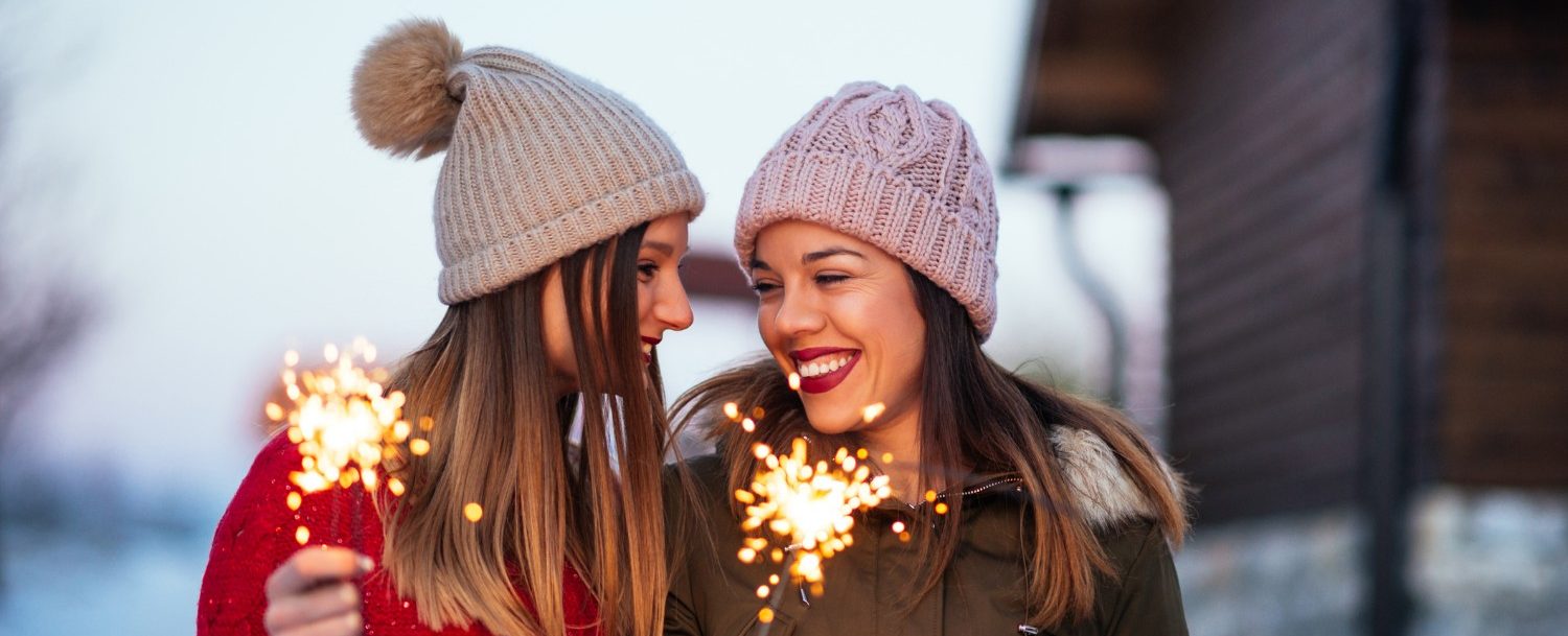 Photo of impatient young women waiting to have fun outside with sparklers at Sandestin New Year's Eve