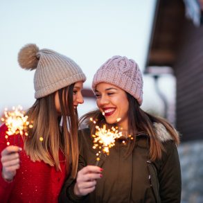 Photo of impatient young women waiting to have fun outside with sparklers at Sandestin New Year's Eve