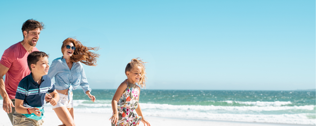 family running on beach