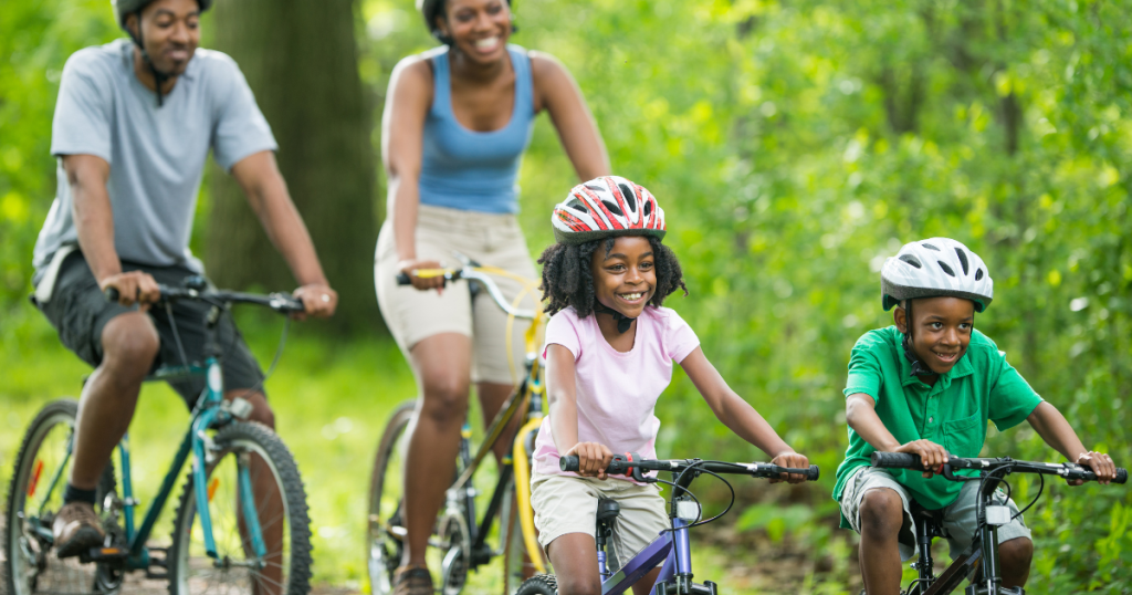 family of four riding bikes