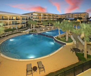 aerial view of resort pool at sunset