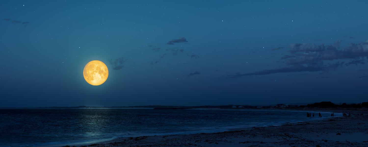 full moon over ocean