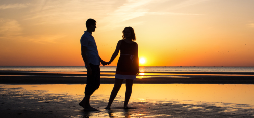 couple on beach at sunset