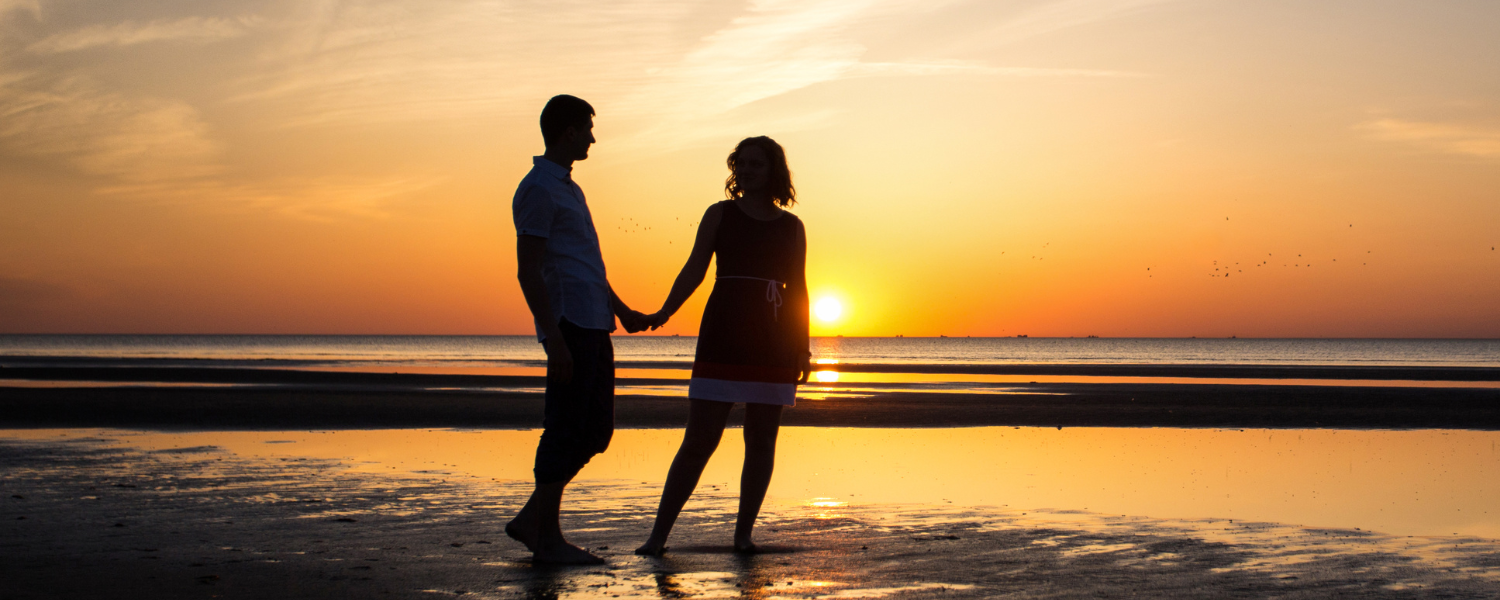 couple on beach at sunset