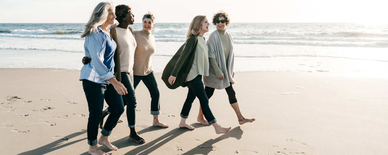 group of women along on beach in winter