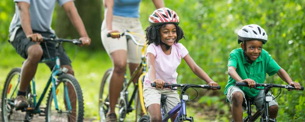 black family riding bikes