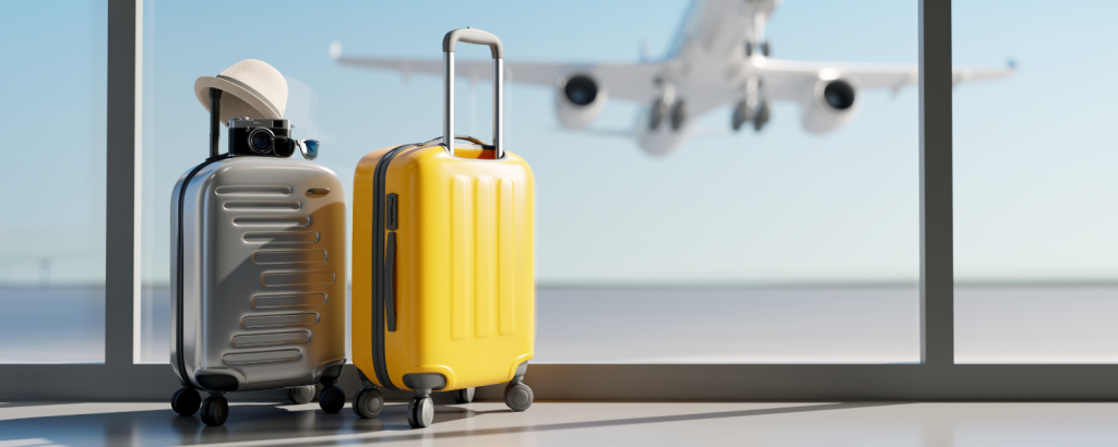 two suitcases with airplane in background