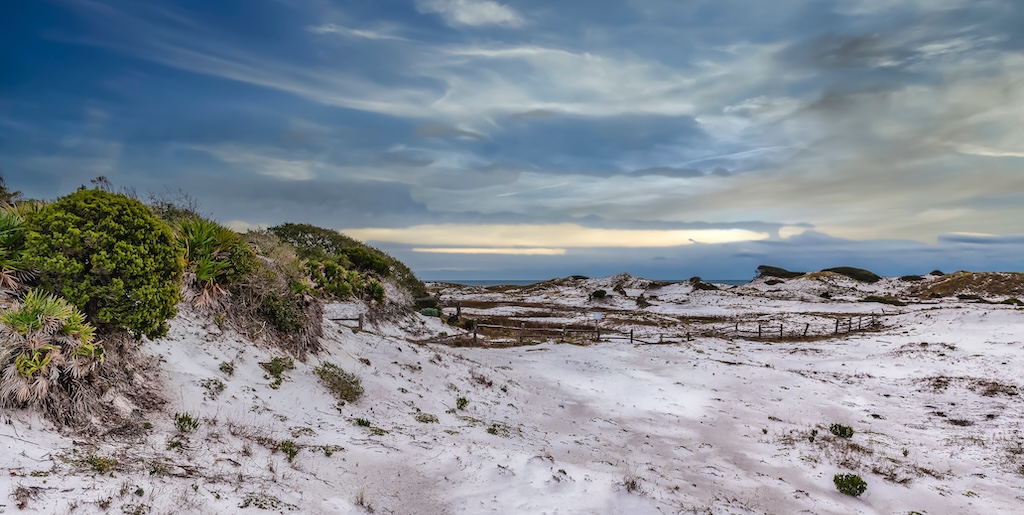 Deer Lake State Park, South Walton County, Florida. Sugar white sand dunes and broken down fence.