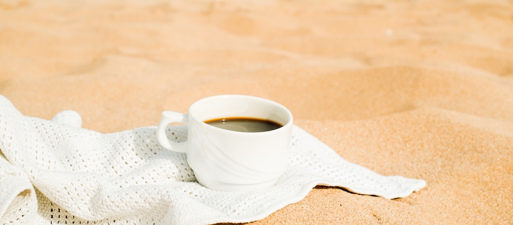 coffee espresso cup with ocean,beach and seascape.